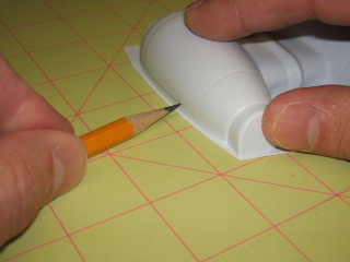 Marking pod half for trimming.
