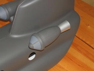 Completely painted engine pod installed on helicopter.